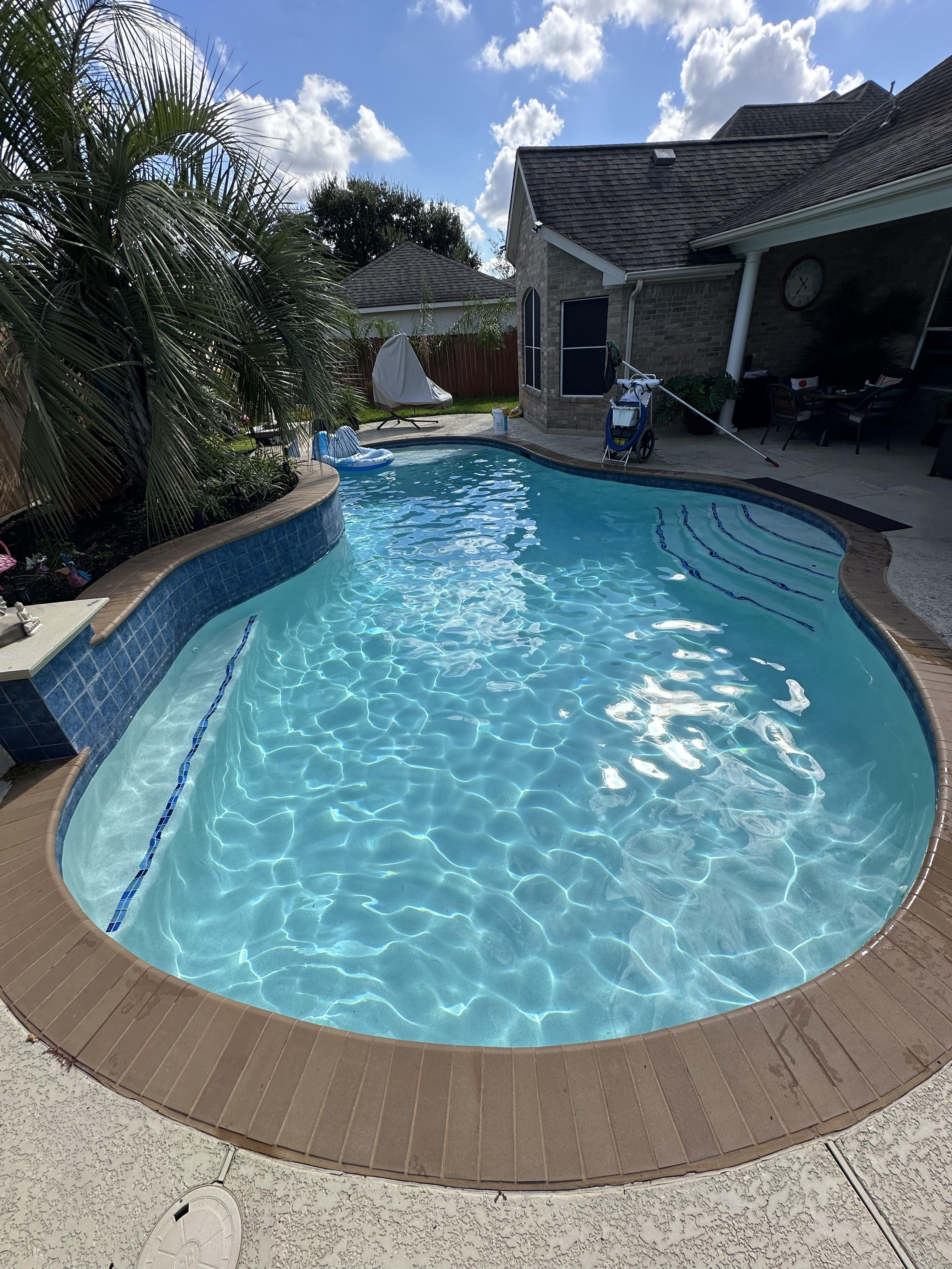 Luxury residential swimming pool maintained by Bluecrest Pools in Tomball, Texas