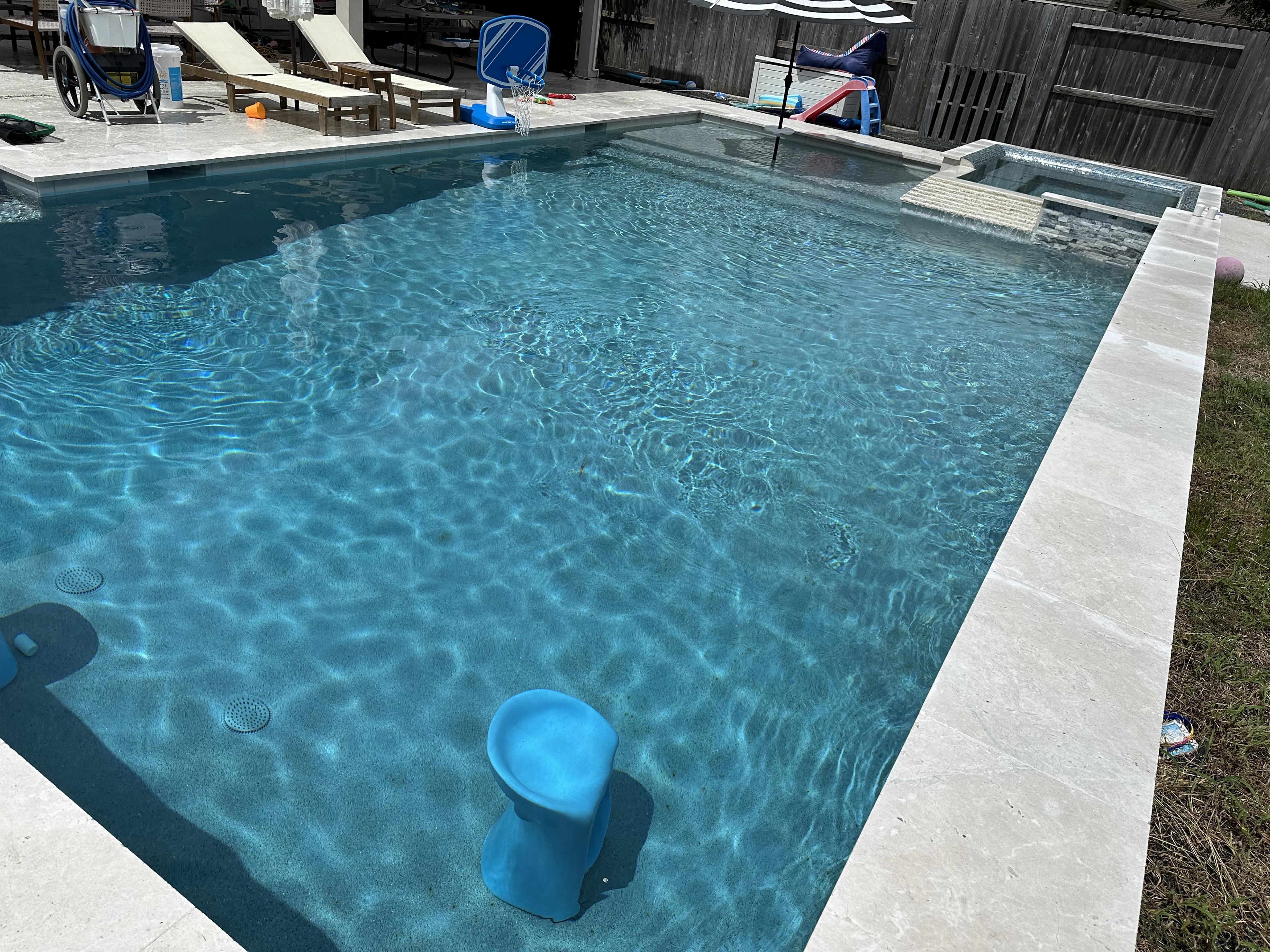 Modern backyard pool maintained by Bluecrest Pools