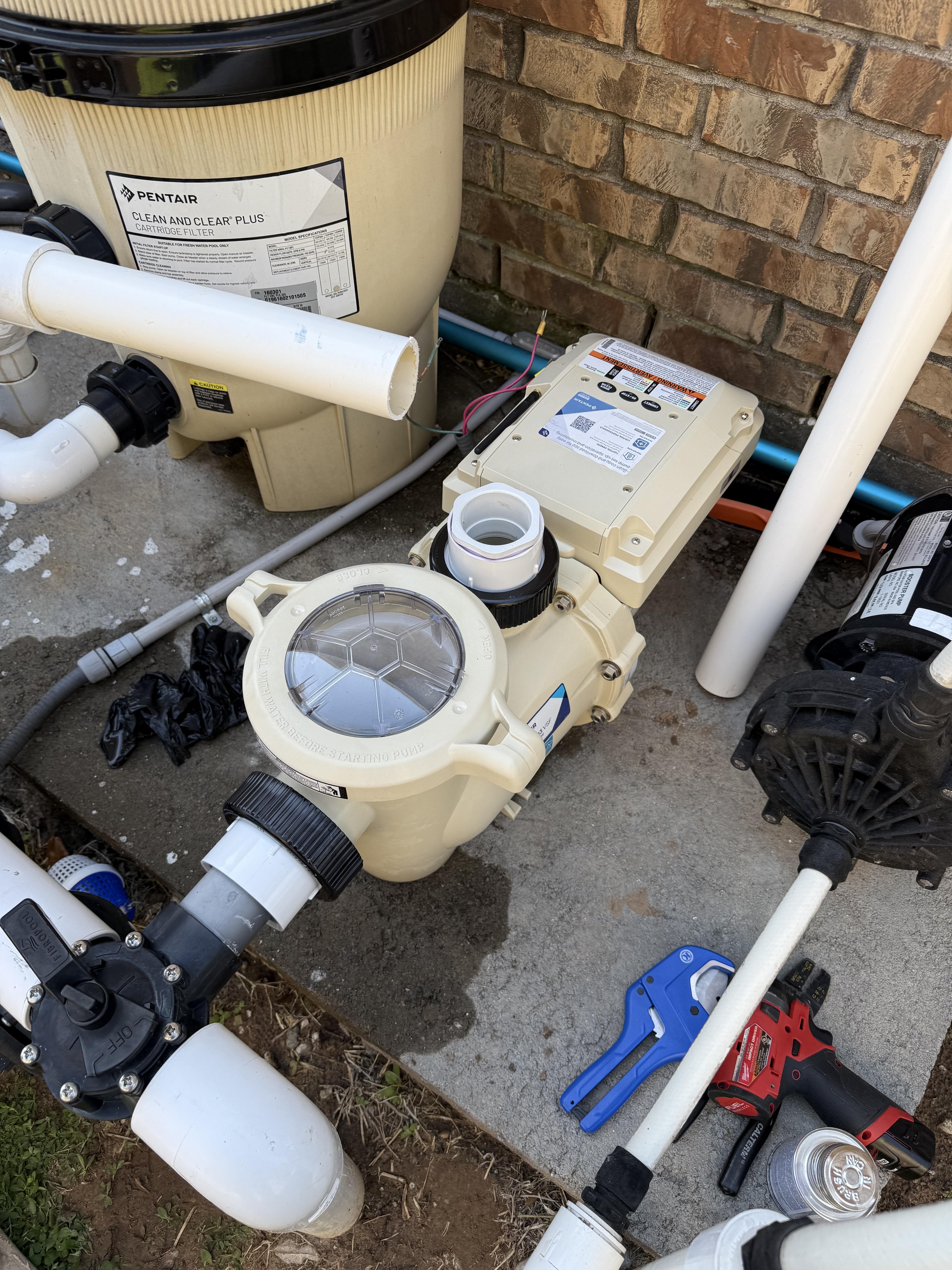 A Bluecrest technician servicing pool equipment