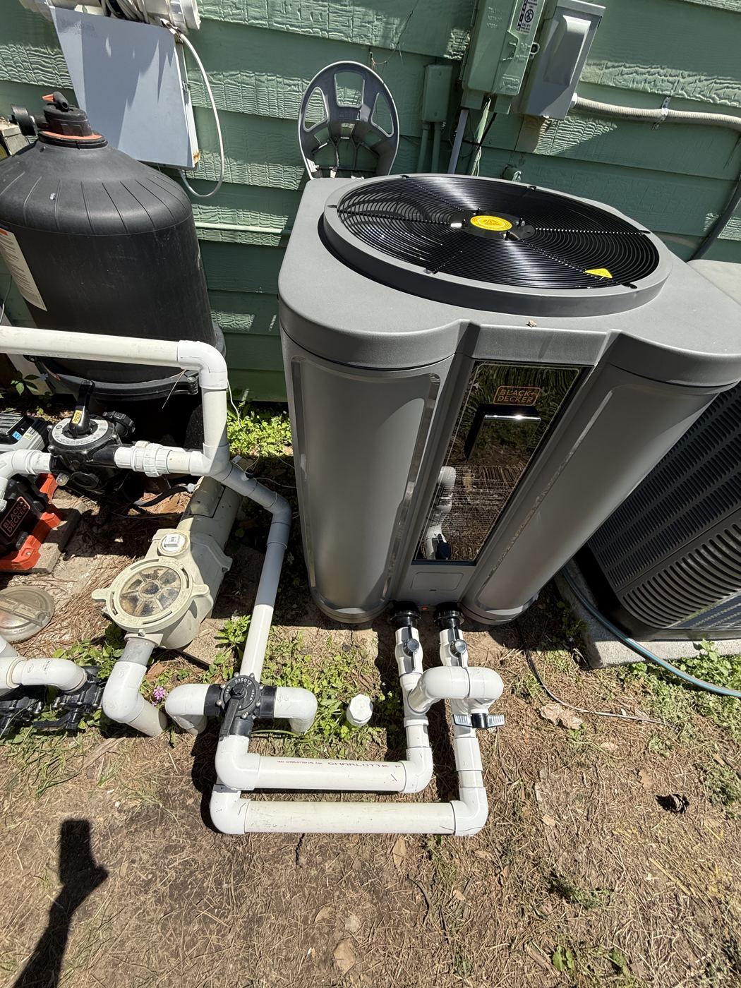 Pool heater and plumbing at a customer equipment pad
