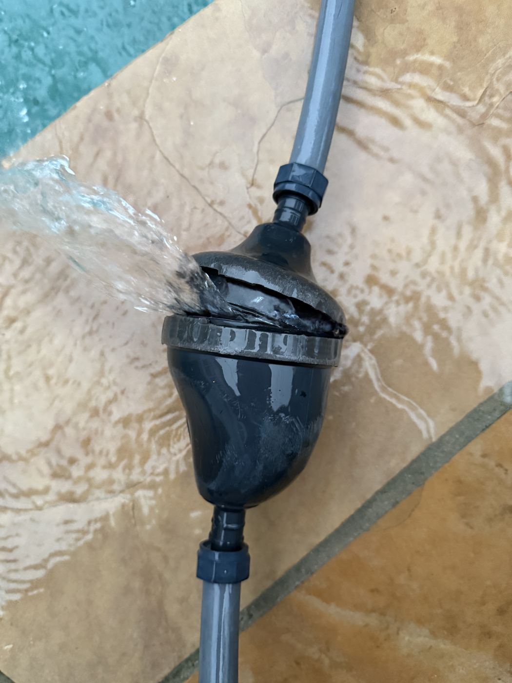 Pool plumbing and fittings being checked for leaks